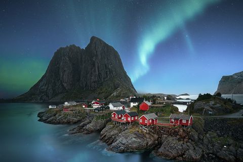 dawn in small viilage, lofoten and magic northern lights in sky