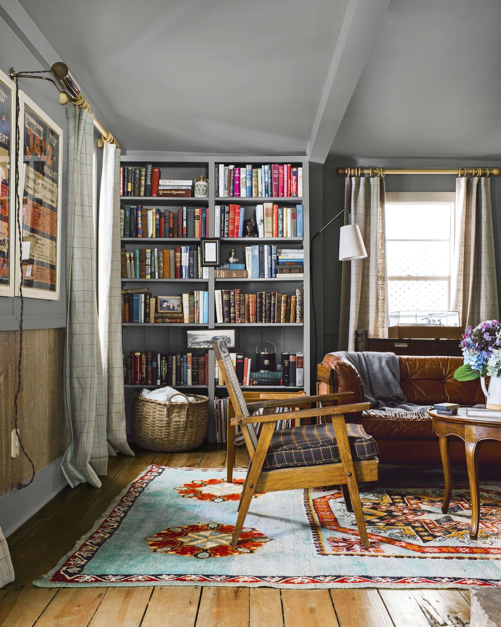 cozy gray study with leather sofa and bookcases