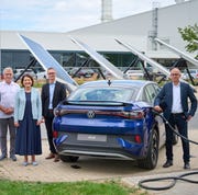 the high power charging park with new automotive powerbank in the background is open from left florian köhler, project manager aw automotive, ingolf keller, energy officer, karen kutzner, managing director finance and controlling vw saxony, lars thielemann, head of planning and jörg engelmann, head of innovation