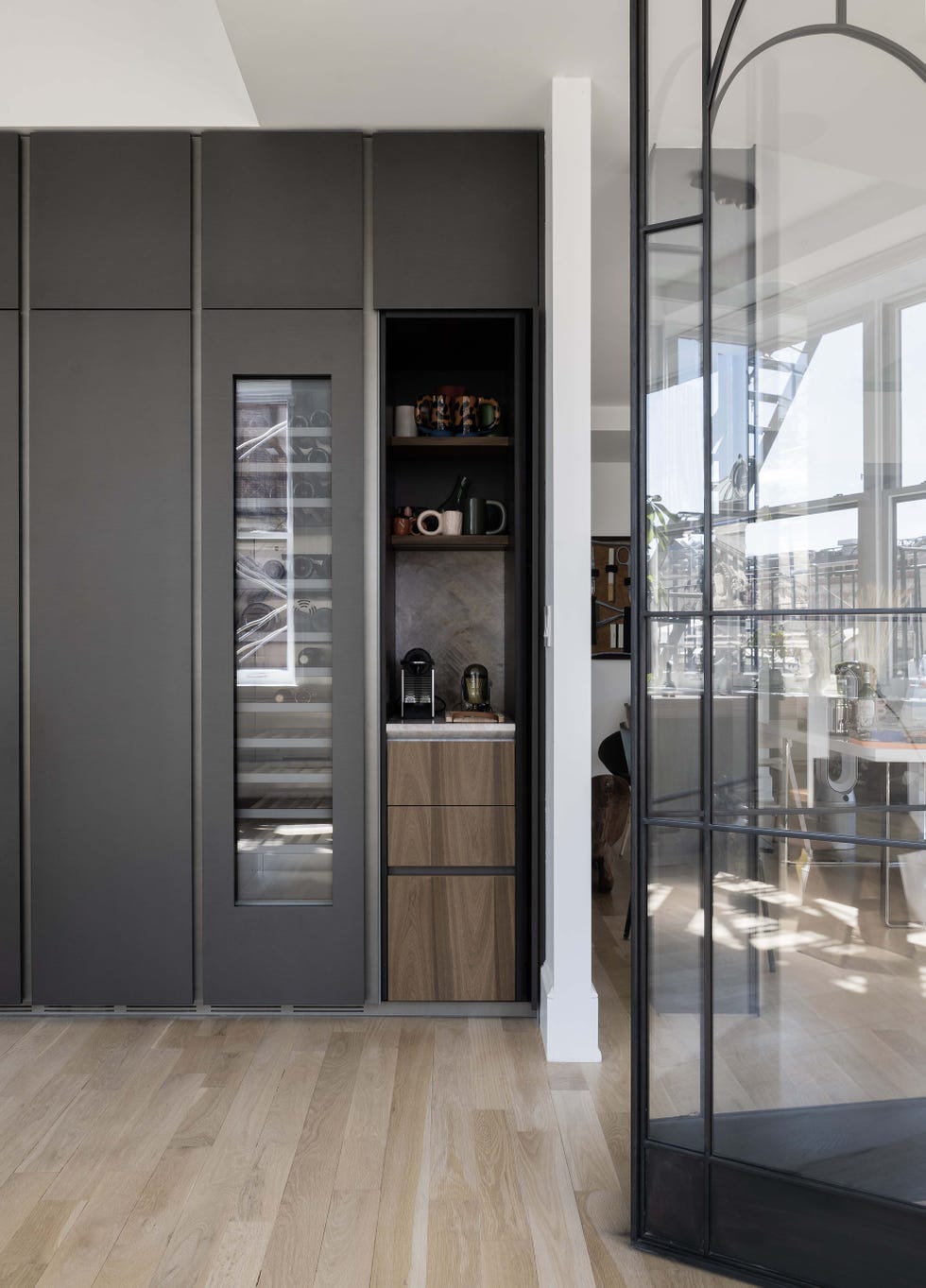 a view towards a gray wine refrigerator 