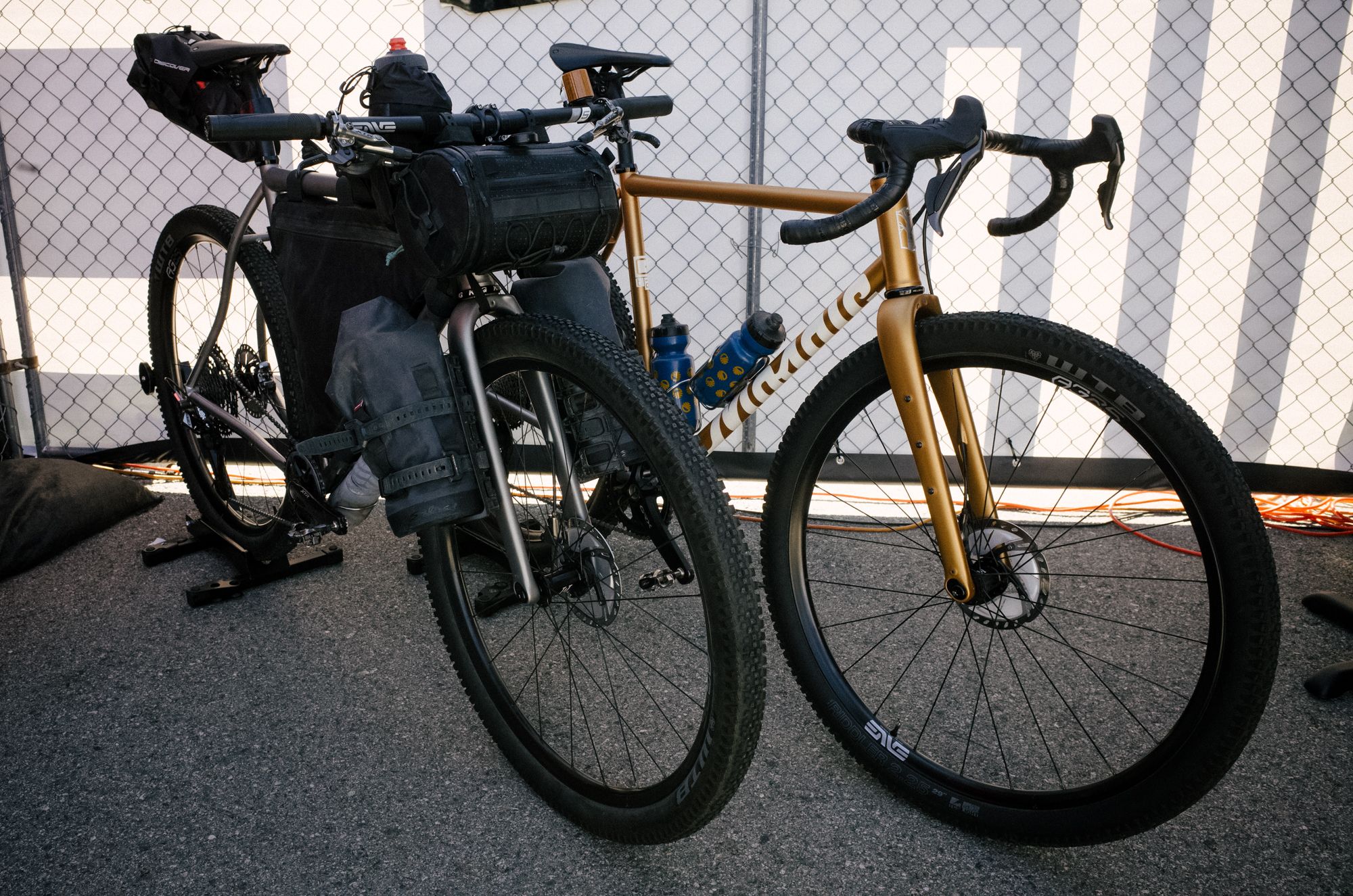 One of these is a stock-sized Mosaic, the other is custom. One of these is a gravel bike, the other might be a mountain bike? Touring bike? Bikepacking bike? 