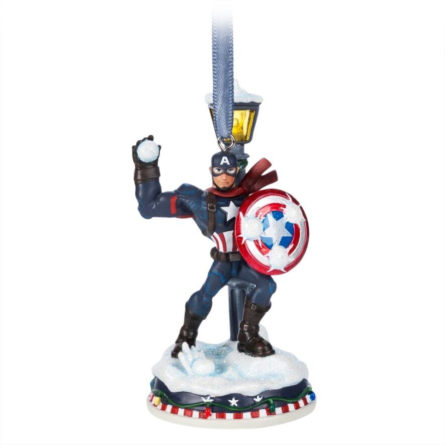 a toy figurine holding a shield and sword