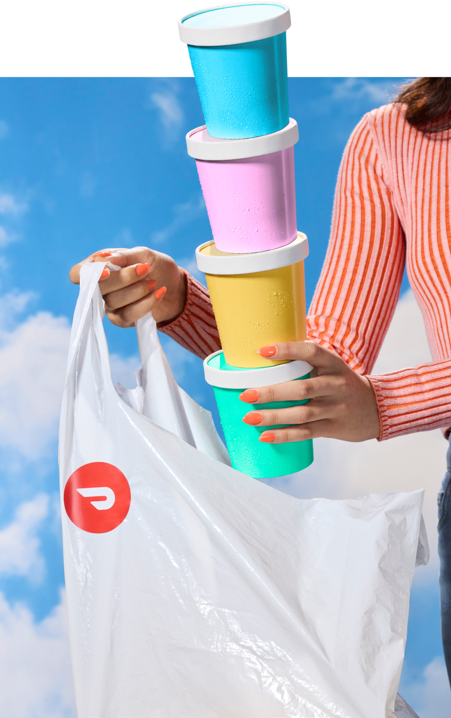 a person holding pints of ice cream