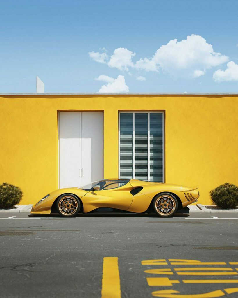 a yellow sports car parked in front of a yellow building