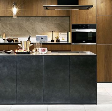 a kitchen with black cabinets