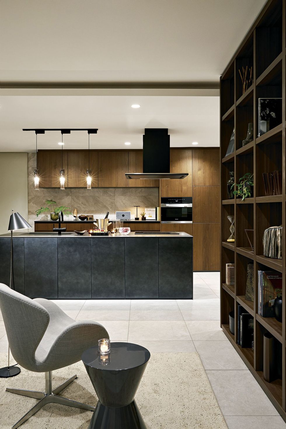 a kitchen with a bar and chairs
