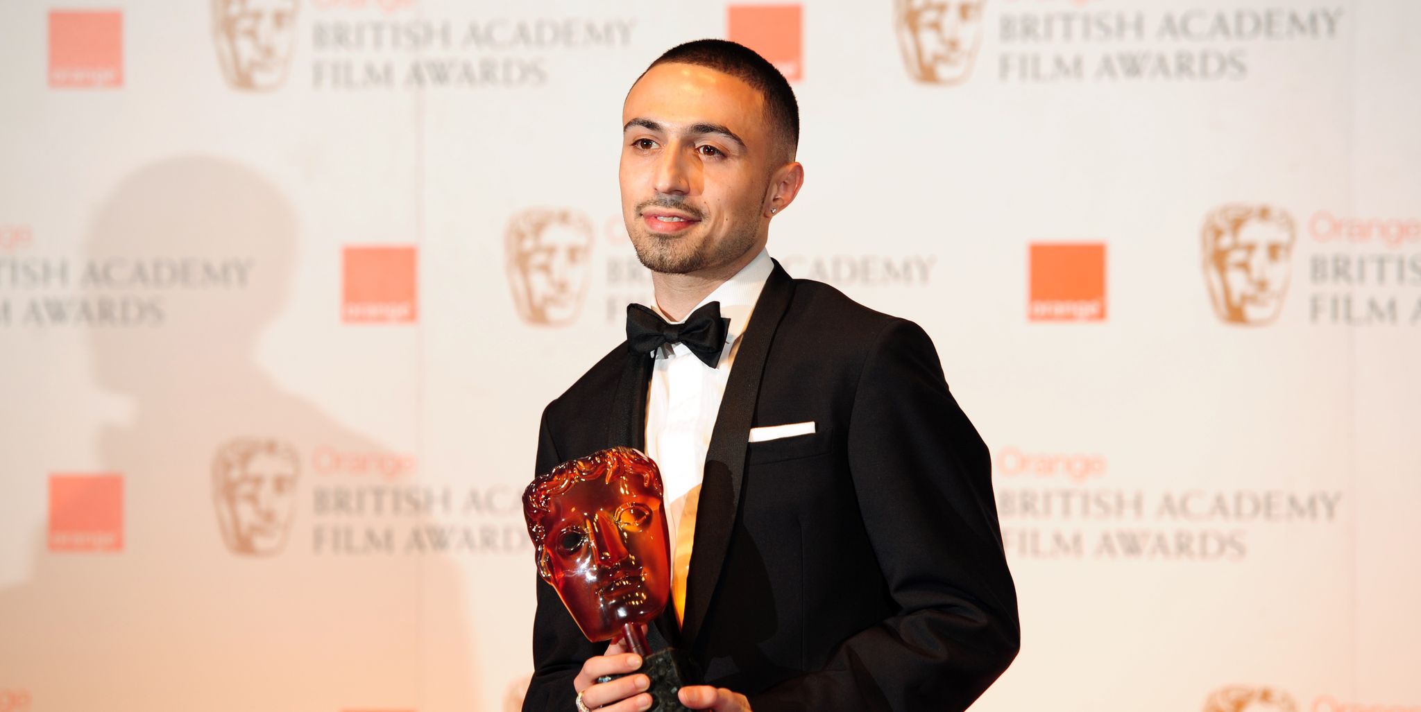 british actor adam deacon poses with the rising star award at the bafta british academy film awards at the royal opera house in london on february 12, 2012  afp photo  leon neal photo credit should read leon nealafp via getty images