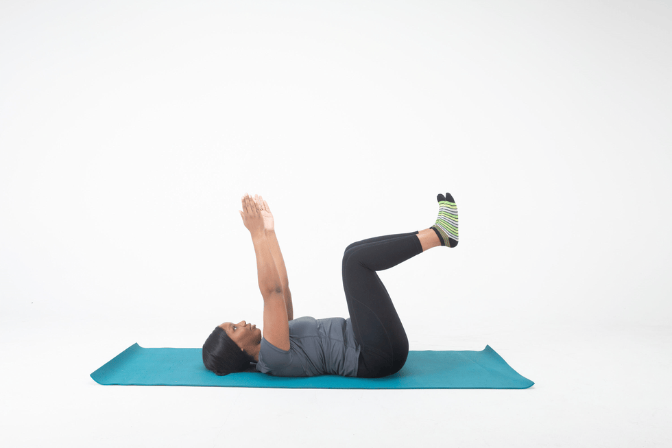 person performing an exercise on a yoga mat