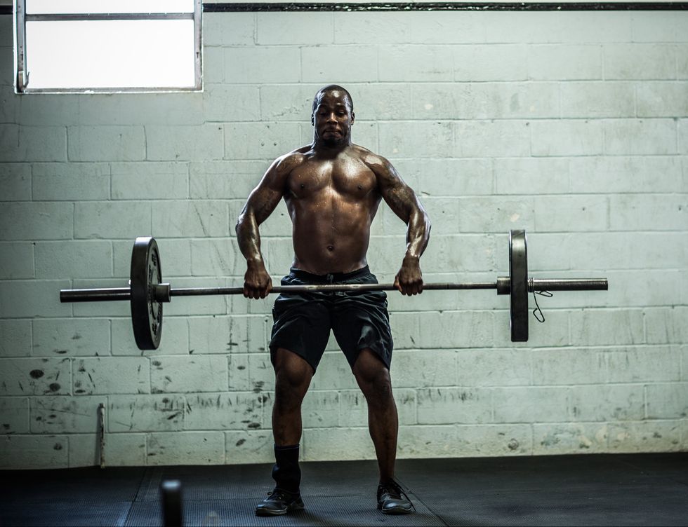 a muscular man lifting weights