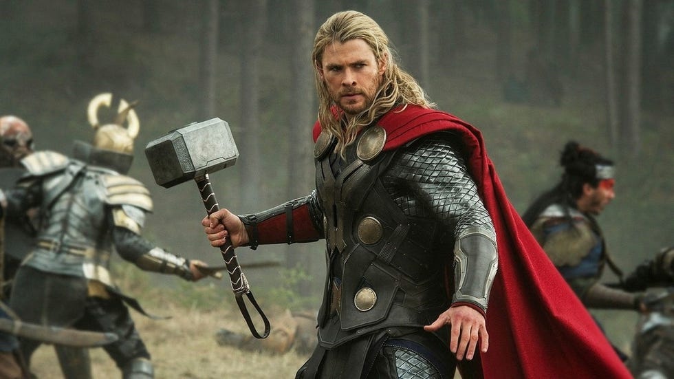 thor holding his hammer in a scene from thor