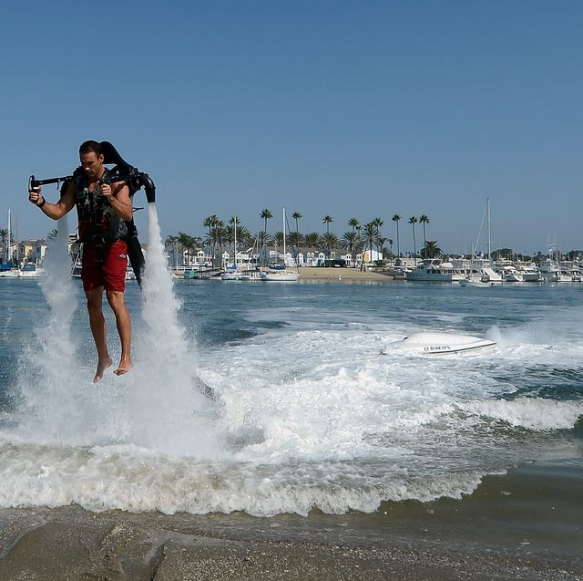 https://hips.hearstapps.com/hmg-prod/images/dean-omalley-flies-using-a-jetlev-a-water-powered-jetpack-news-photo-1690747690.jpg?crop=0.595xw:1.00xh;0.0913xw,0&resize=640:*