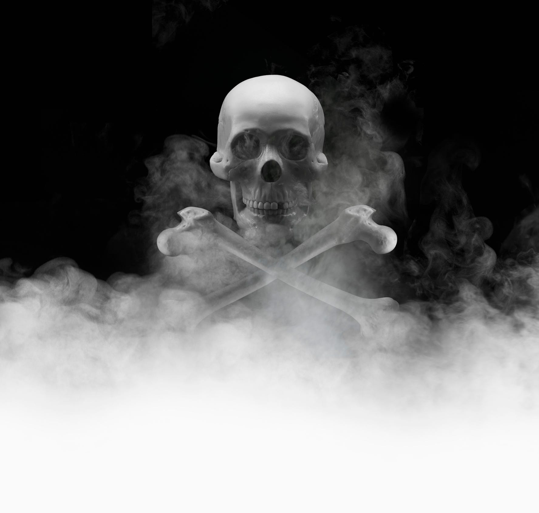 Skull and crossbones in smoke