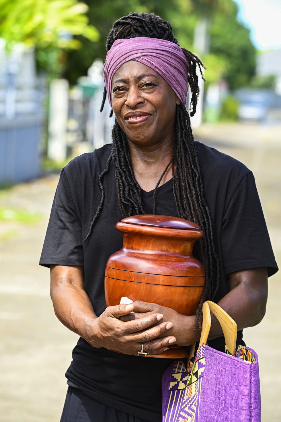 death in paradise judith jacob as dorna bray holding urn