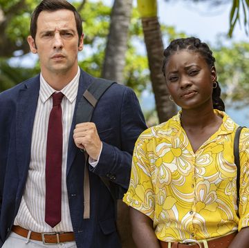 ralf little as neville and shantol jackson as naomi in a scene from death in paradise season 12