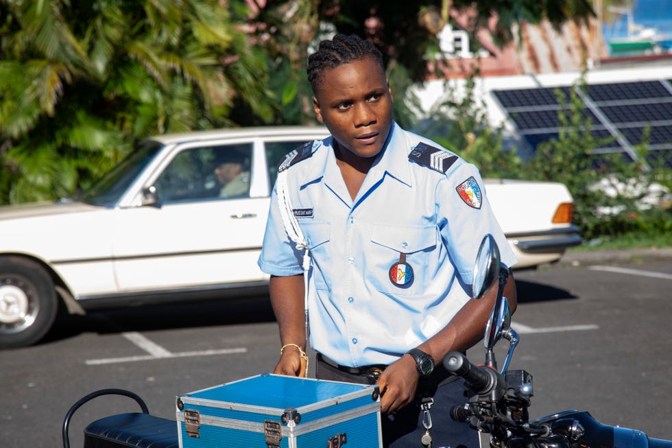 death in paradise series 10   tobi bakare as jp hooper on a police motorbike