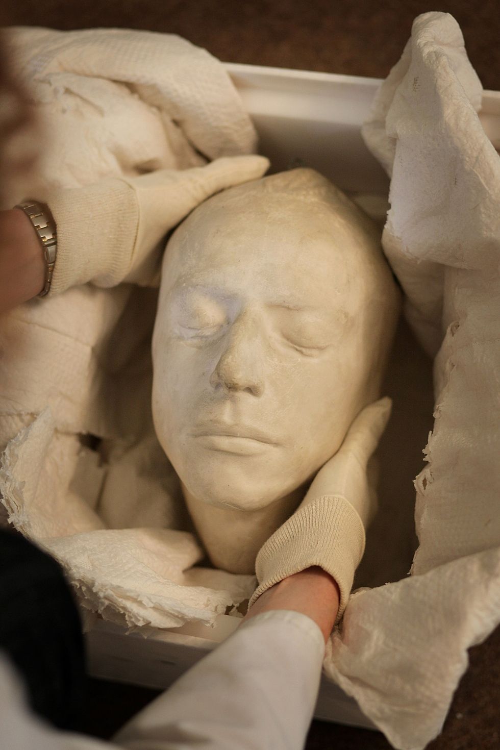 English poet John Keats' death mask is prepared for display at his house on July 22, 2009 in London, England. Keats' House, the former home of renowned English poet John Keats, is to reopen to the public after recent refurbishment. The Grade I-listed house in Hampstead has been transformed thanks to a Heritage Lottery Fund grant of £420,000. Keats lived in the house from 1818 to 1820 and it was here that he wrote 'Ode to a Nightingale' and fell in love with Fanny Brawne, the girl next door. It was from this house that he travelled to Rome, where he died of tuberculosis aged just 25. (Photo by Peter Macdiarmid/Getty Images)