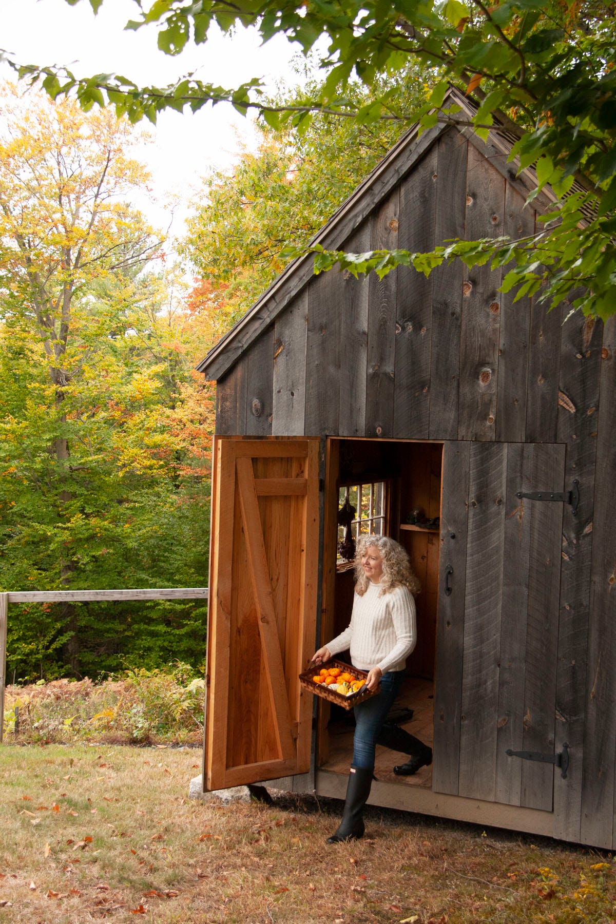 woman walking out of barn