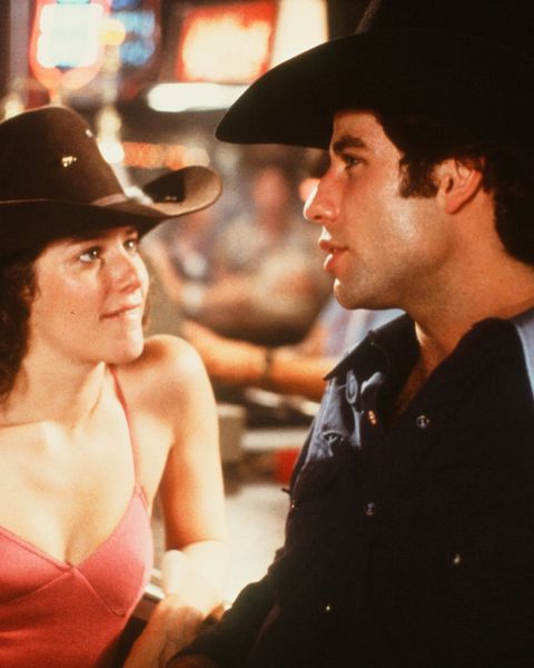circa 1980 actor john travolta and debra winger talk in a scene during the paramount pictures movie  'urban cowboy" circa 1980 photo by hulton archivegetty images