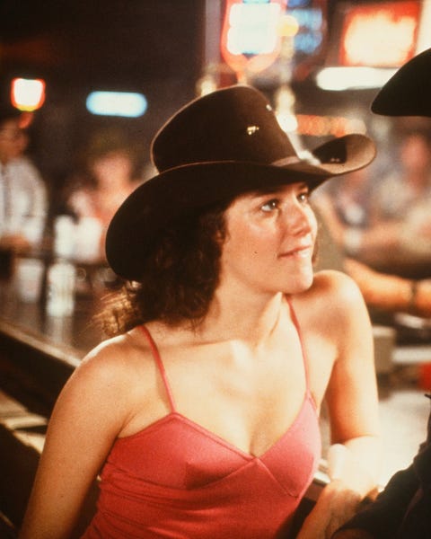 circa 1980 actor john travolta and debra winger talk in a scene during the paramount pictures movie  'urban cowboy" circa 1980 photo by hulton archivegetty images