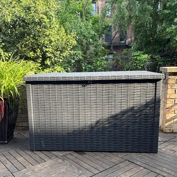 best deck boxes outdoor storage box surrounded by greenery