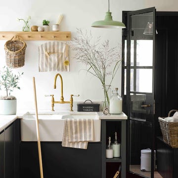 kitchen with dark cabinets and a butler sink