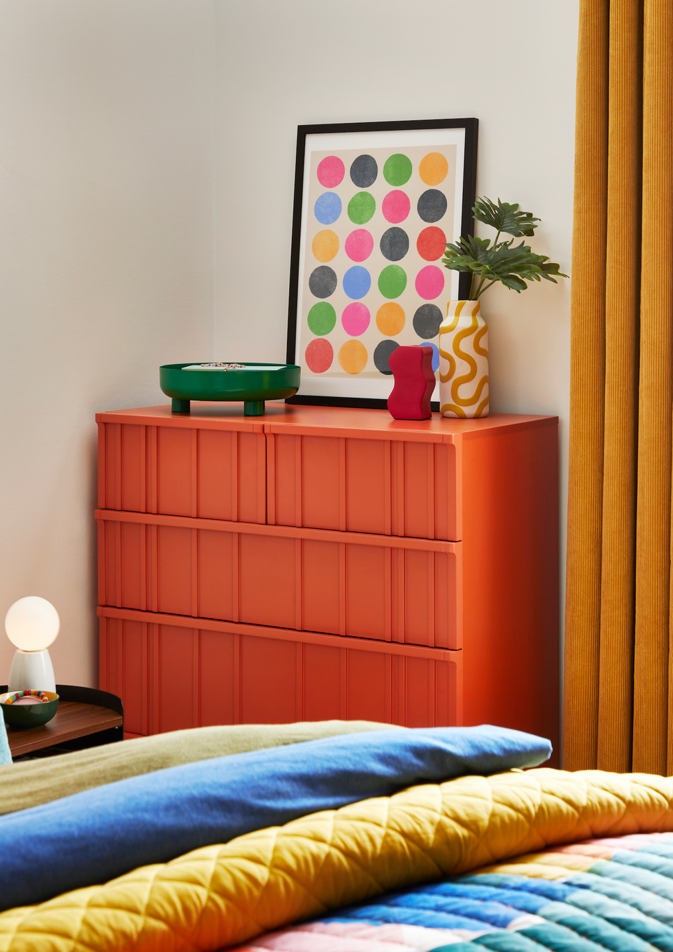 orange sideboard in bedroom