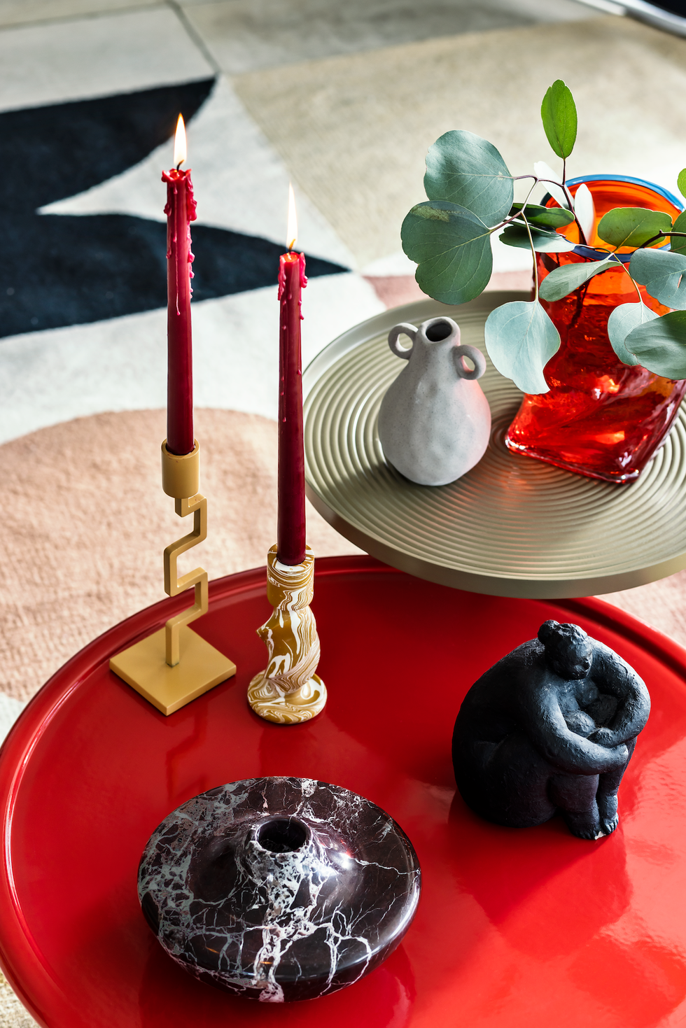 red coffee table and gold side table