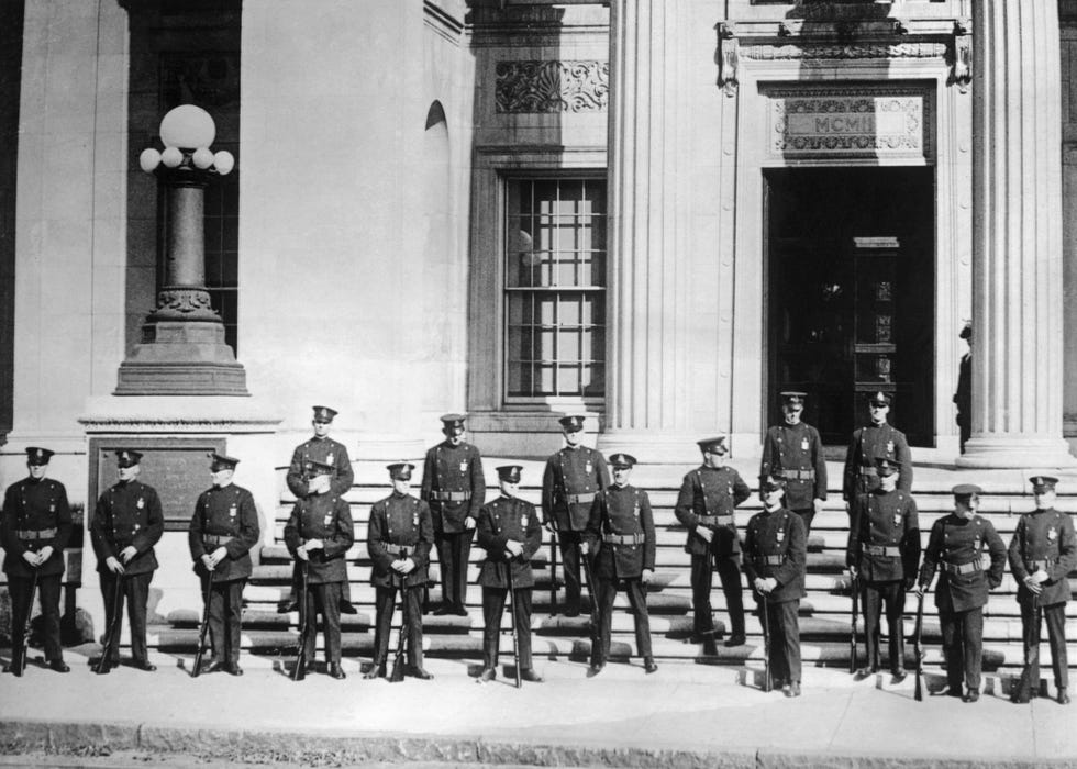 policemen guarding a courthouse