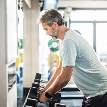dedicated mature man exercising in a gym