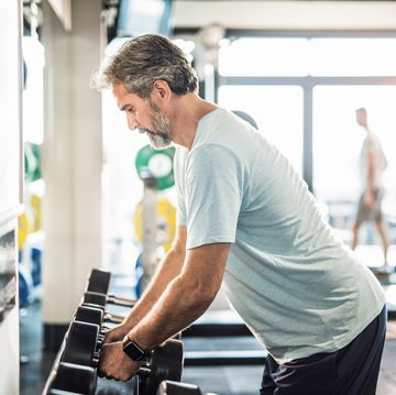 dedicated mature man exercising in a gym