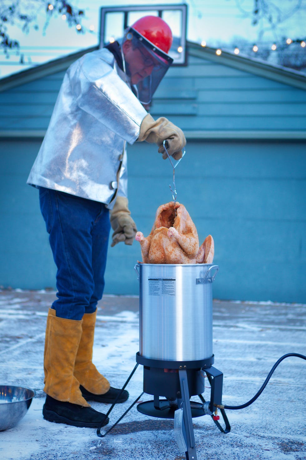 deep frying turkey in hot oil for christmas and thanksgiving