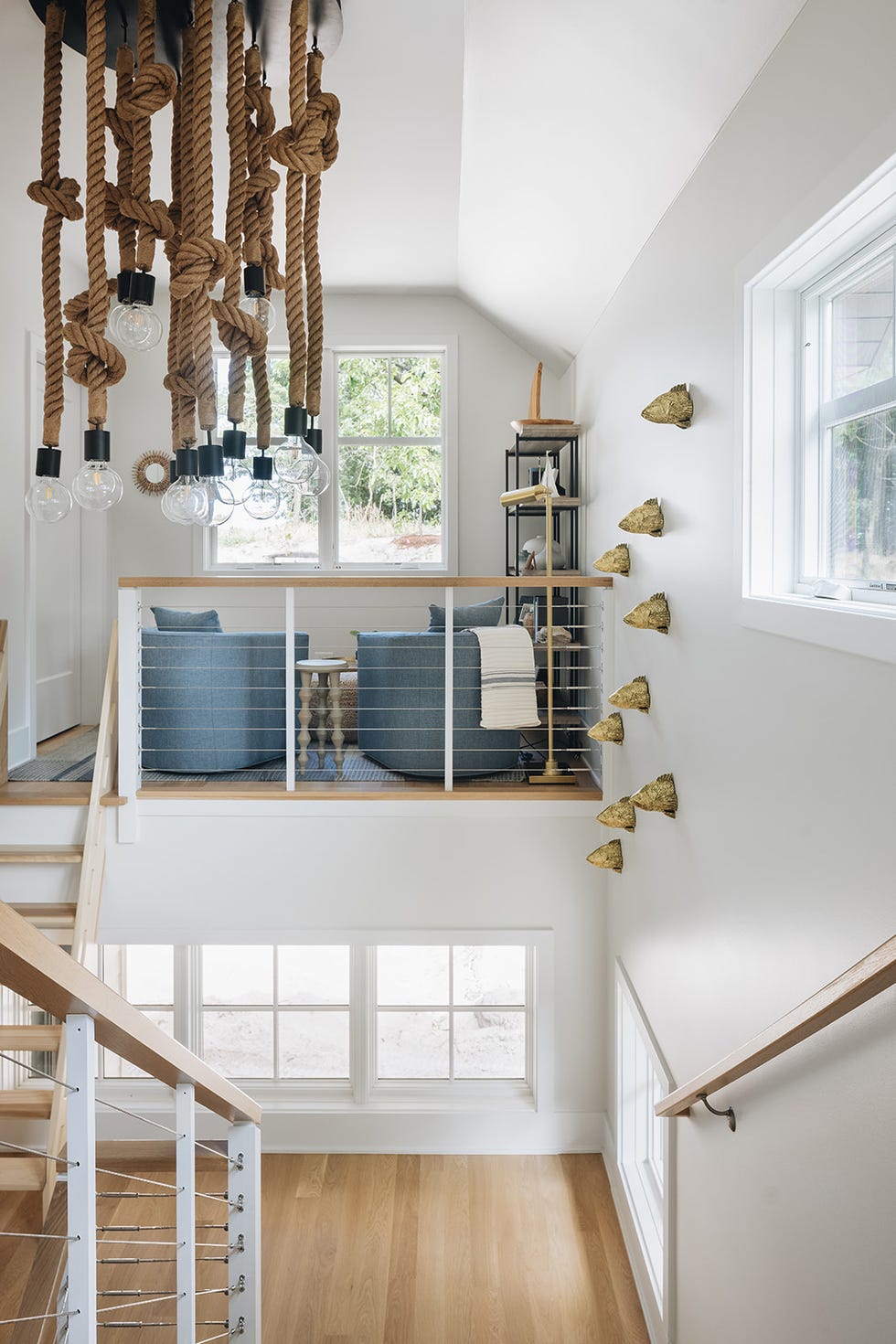 Interior view of a modern staircase and upper lounge area