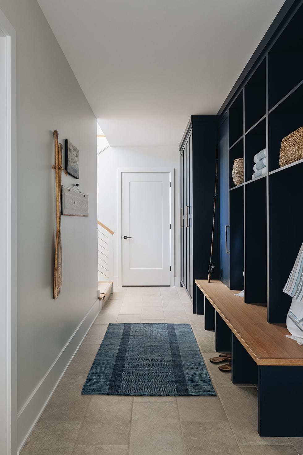 Spacious entryway with storage and a door