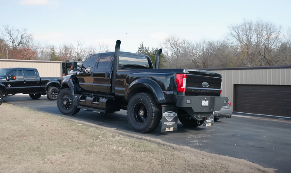 a black truck with a trailer