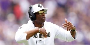 head coach deion sanders of the colorado buffaloes wearing blenders sunglasses on sidelines