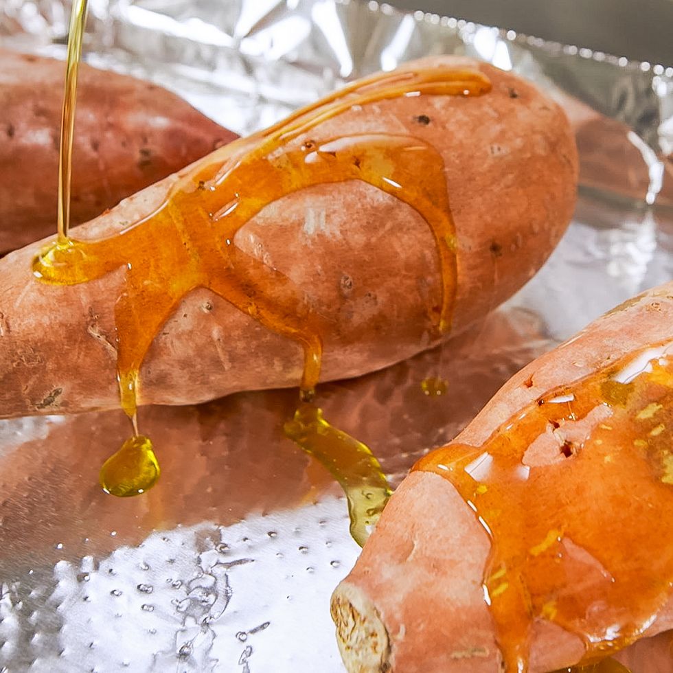 drizzling sweet potatoes with oil