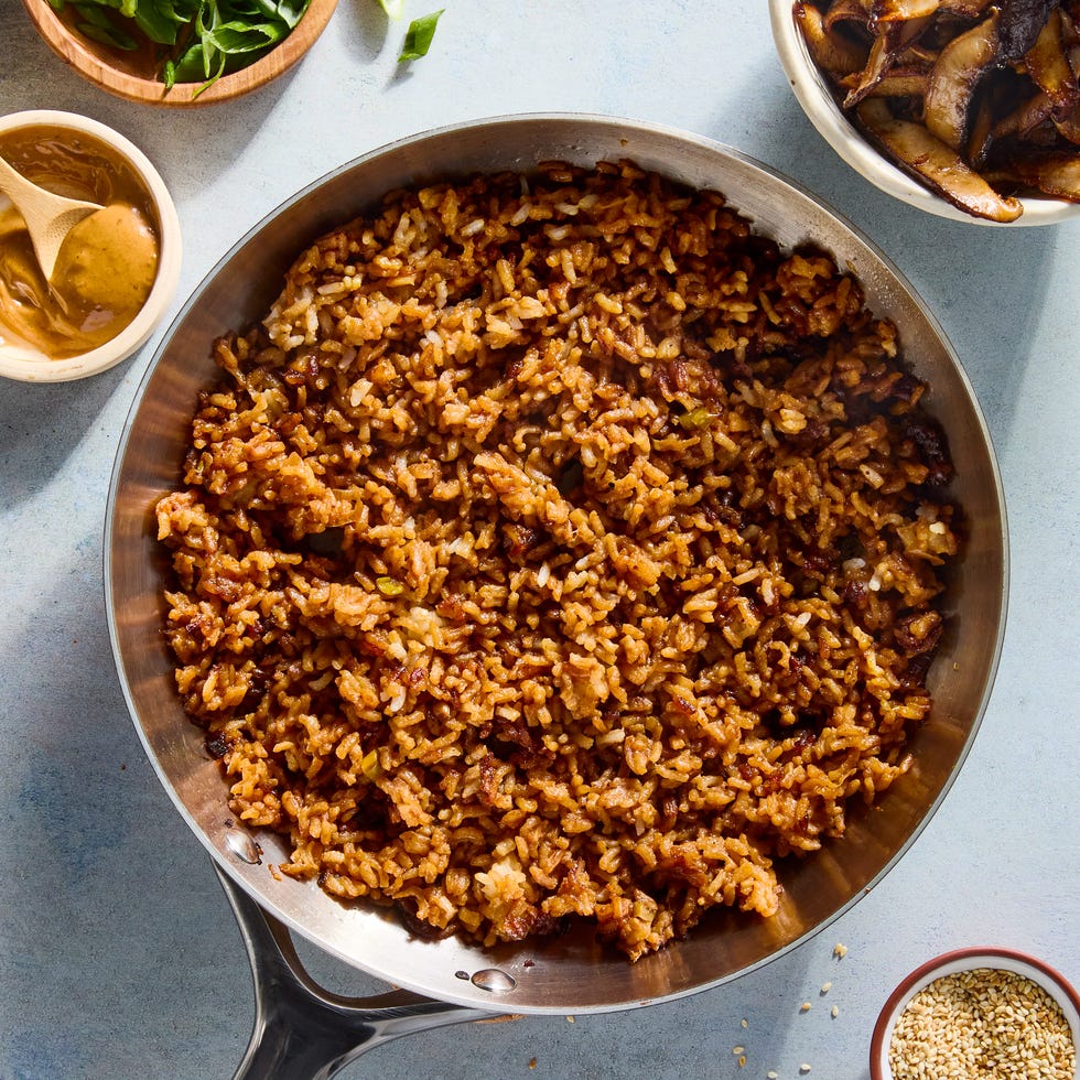 red miso sushi rice cooked in butter until a deep golden brown and topped with ginger and garlic studded mushrooms, and drizzled with spicy miso mayo