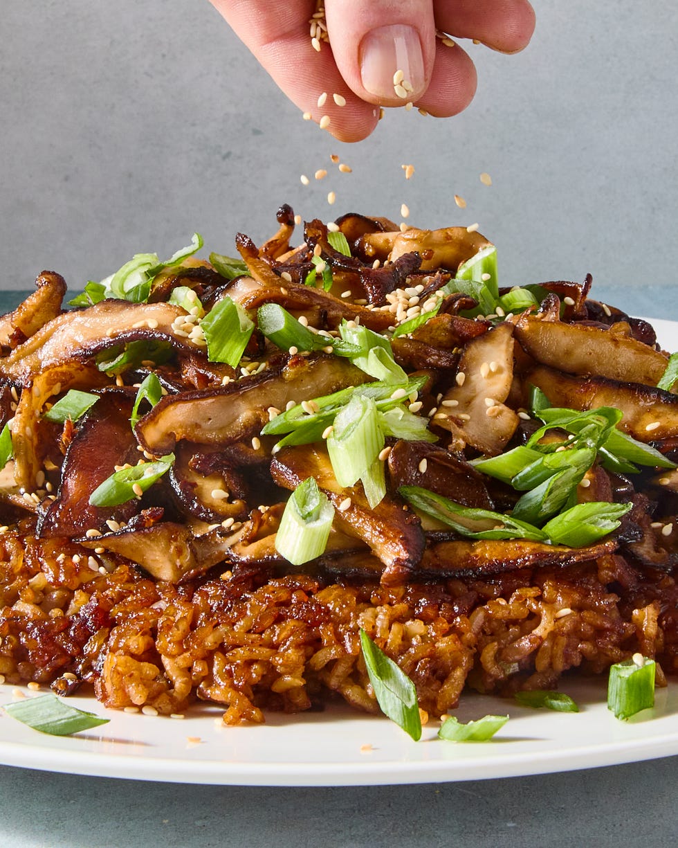 red miso sushi rice cooked in butter until a deep golden brown and topped with ginger and garlic studded mushrooms, and drizzled with spicy miso mayo