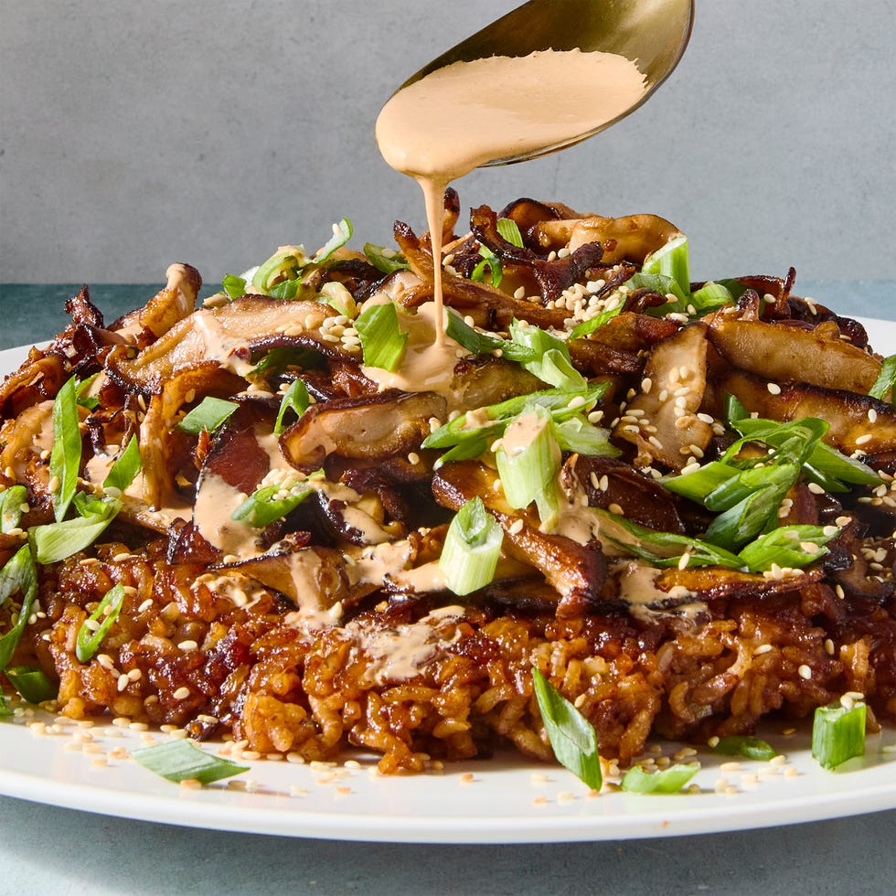 red miso sushi rice cooked in butter until a deep golden brown and topped with ginger and garlic studded mushrooms, and drizzled with spicy miso mayo