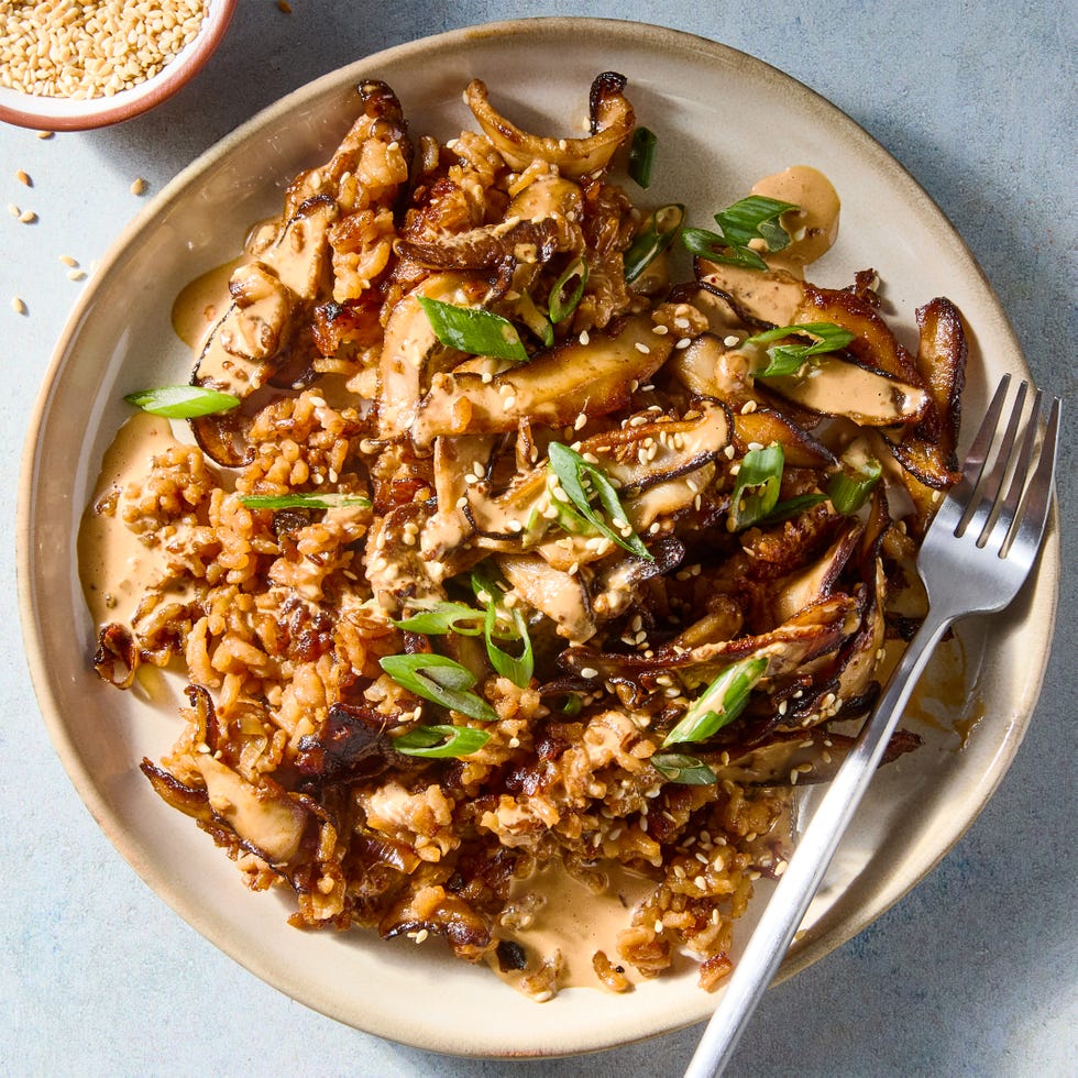 red miso sushi rice cooked in butter until a deep golden brown and topped with ginger and garlic studded mushrooms, and drizzled with spicy miso mayo