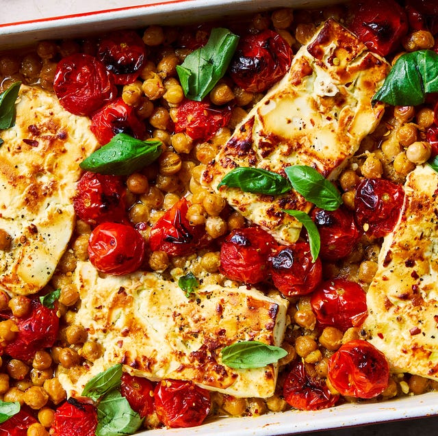 Baked feta chickpeas baked feta chickpeas in a casserole dish with roasted tomatoes and basil