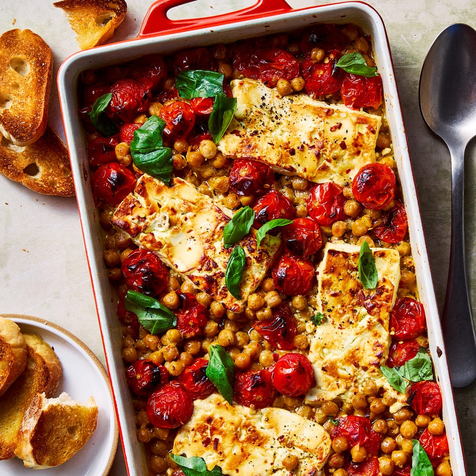 baked feta chickpeas with roasted tomatoes topped with basil