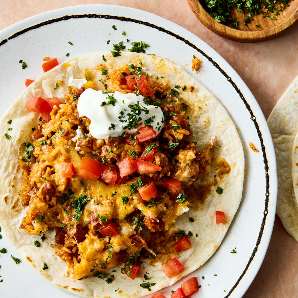 seared chorizo sausage, hearty pinto beans, salsa, and rice are baked until the rice is tender then topped with a mountain of cheese and broiled to melty perfection
