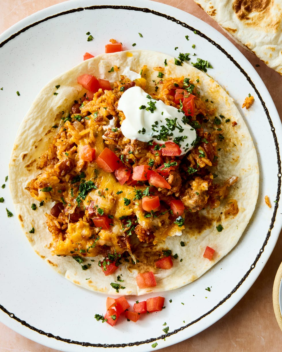 seared chorizo sausage, hearty pinto beans, salsa, and rice are baked until the rice is tender then topped with a mountain of cheese and broiled to melty perfection