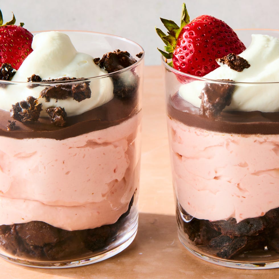 chocolate covered strawberry mousse topped with chocolate ganache, whipped cream, chocolate oreo crunchies, and whole fresh strawberries