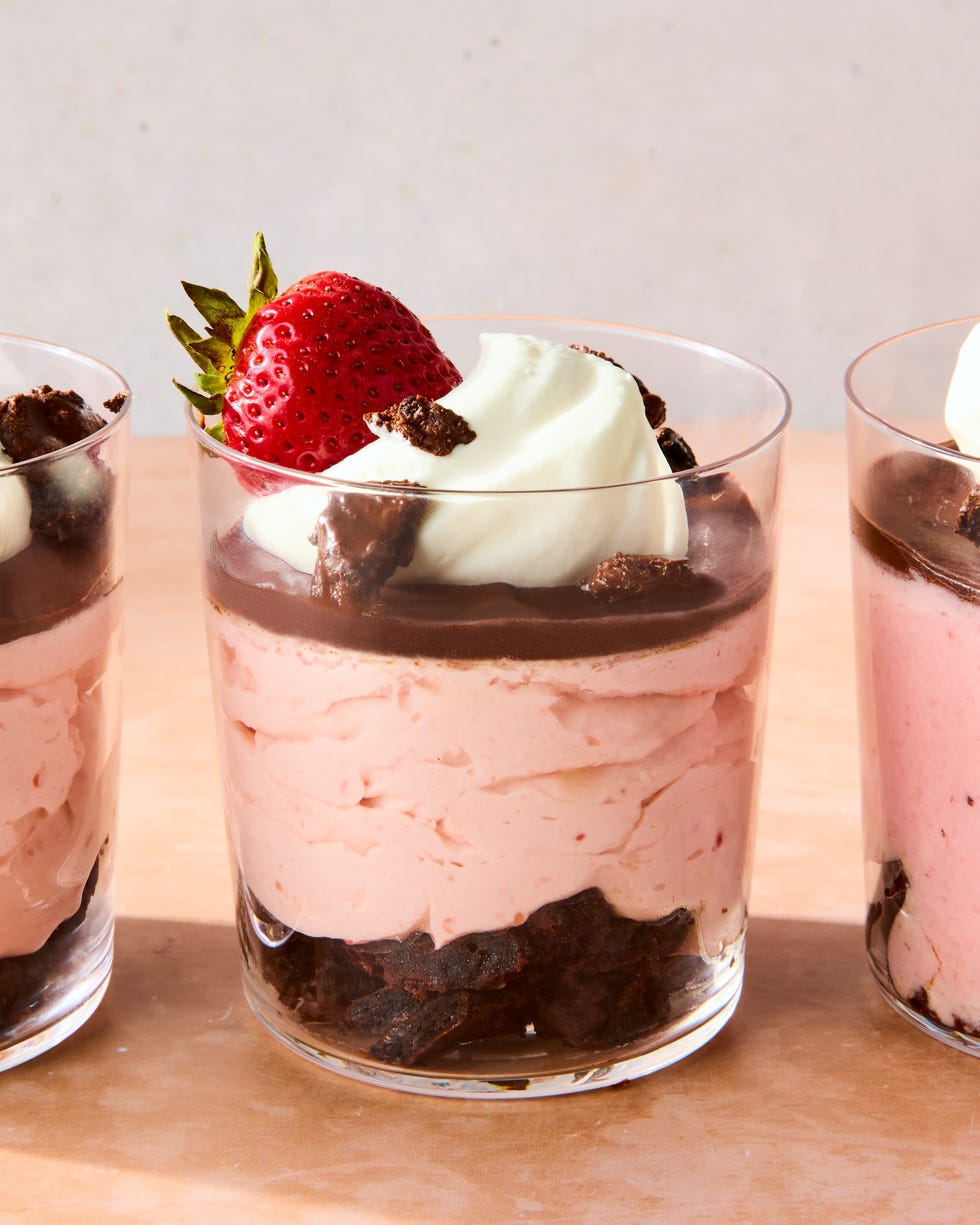chocolate covered strawberry mousse topped with chocolate ganache, whipped cream, chocolate oreo crunchies, and a strawberry