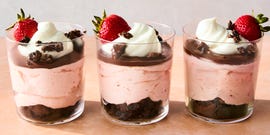 chocolate covered strawberry mousse topped with chocolate ganache, whipped cream, chocolate oreo crunchies, and a fresh strawberry