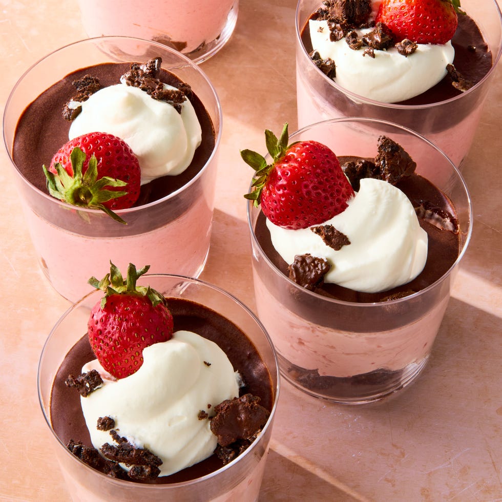 chocolate covered strawberry mousse topped with chocolate ganache, whipped cream, chocolate oreo crunchies, and a fresh strawberry