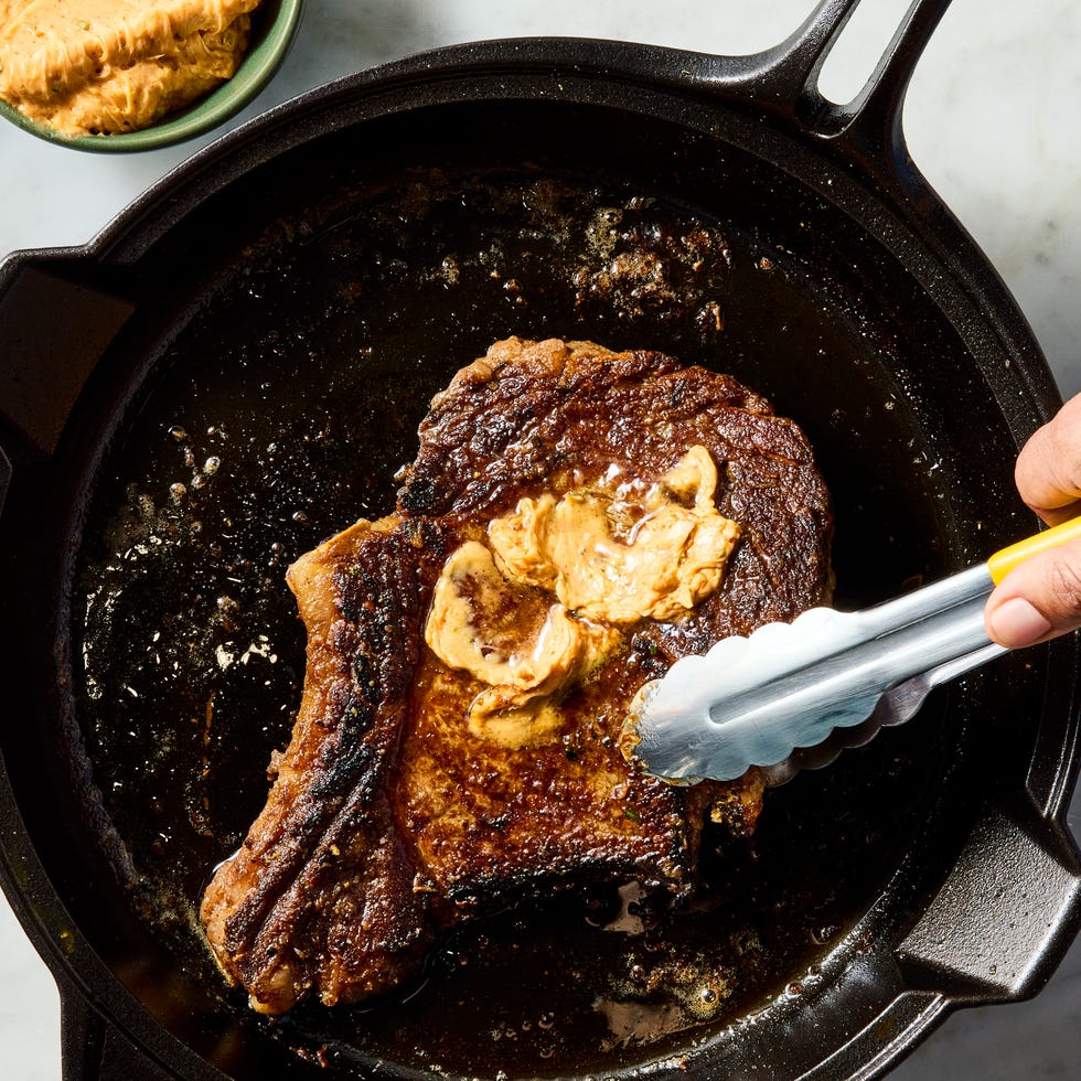 juicy ribeye steak basted and served with zesty spicy butter