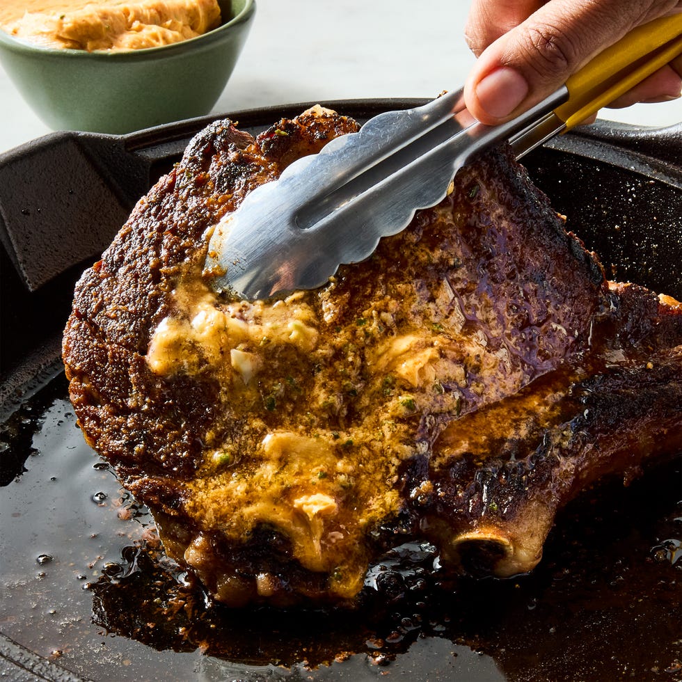juicy ribeye steak basted and served with zesty spicy butter